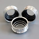 3 circular metallic components coated with fractal black coating from the inside